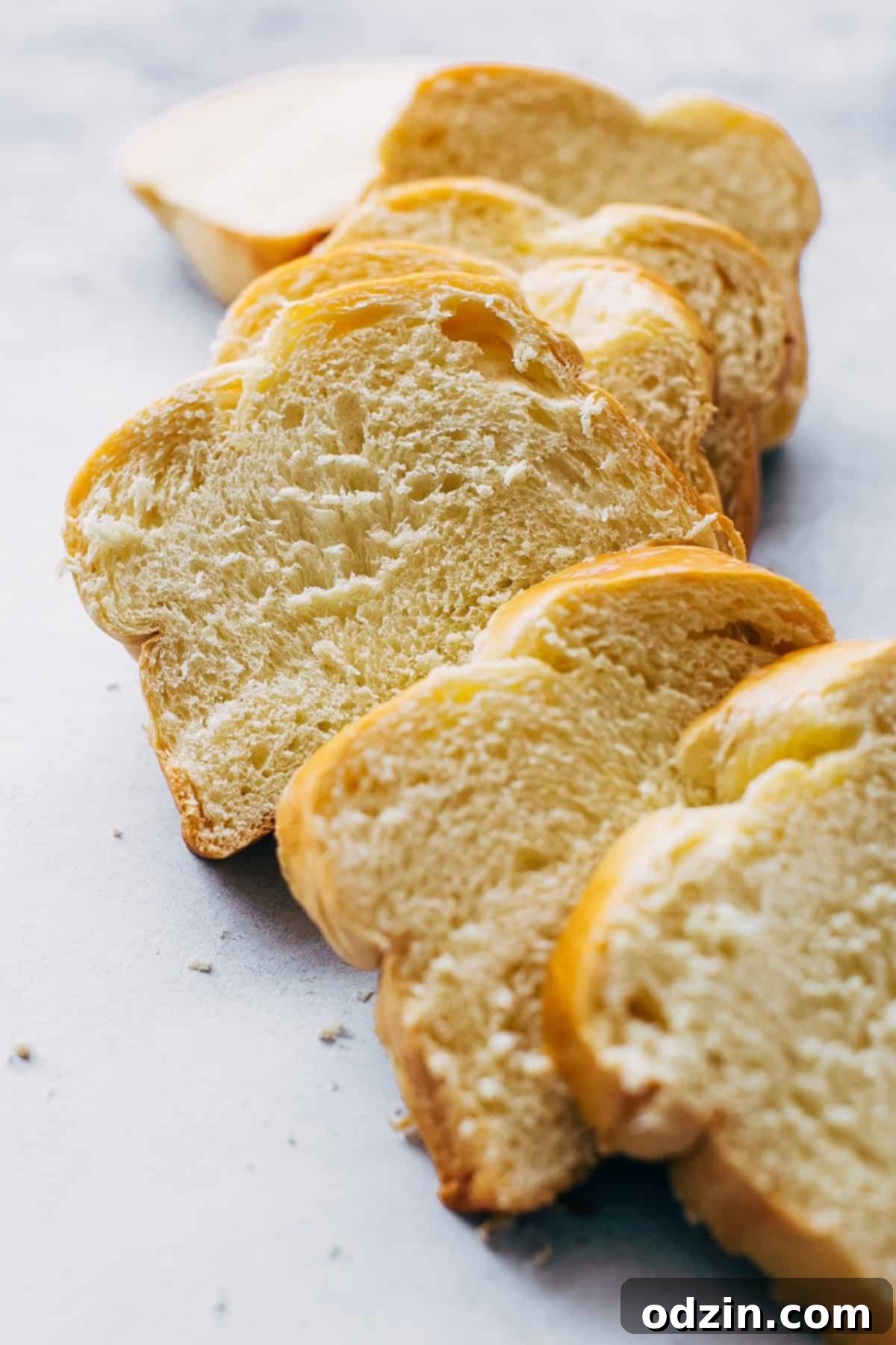 slices of fresh brioche on white surface