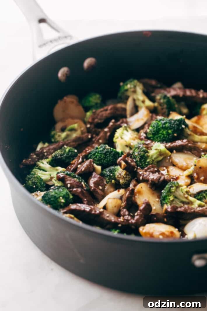 Best Easy Broccoli Beef Stir Fry Recipe - the easiest recipe that takes in the ballpark of 30 minutes to make and tastes better than takeout! #beefandbroccoli #broccolibeef #broccolibeefstirfry #stirfry #takeout | Littlespicejar.com