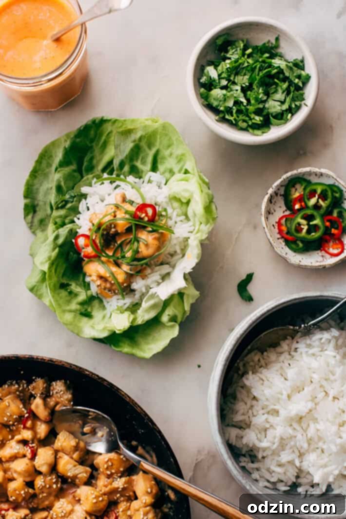 Bang Bang Chicken Lettuce Wraps - a homemade lettuce wrap stuffed with jasmine rice, sautéed chicken and tons of bang bang sauce! #bangbangchicken #bangbangsauce #bangbanglettucewraps #chickenlettucewraps | Littlespicejar.com Bang Bang Chicken Lettuce Wraps - a homemade lettuce wrap stuffed with jasmine rice, sautéed chicken and tons of bang bang sauce! #bangbangchicken #bangbangsauce #bangbanglettucewraps #chickenlettucewraps | Littlespicejar.com