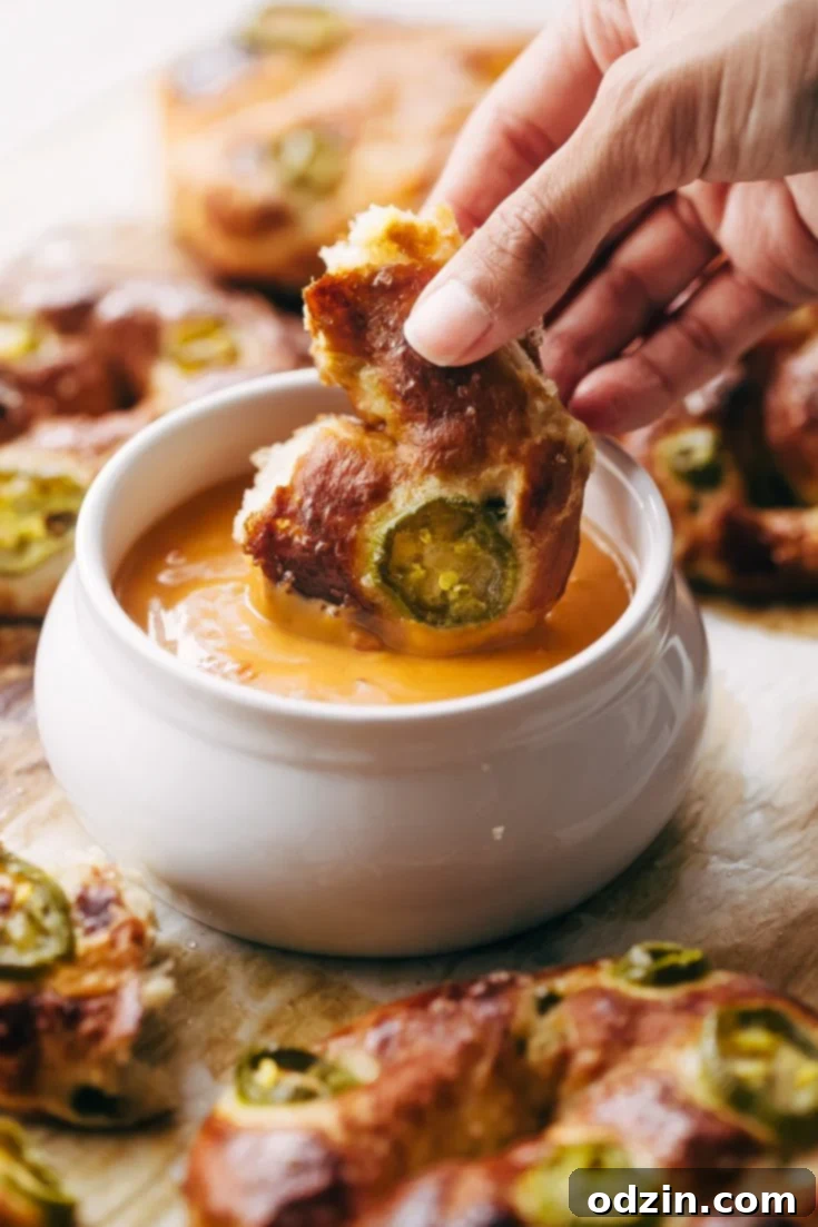 Cheddar Jalapeño Soft Pretzels with a creamy dipping sauce.