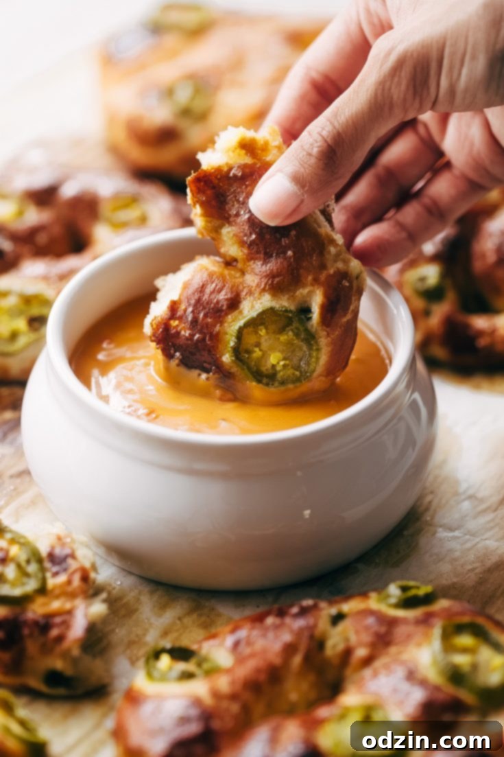 Cheddar Jalapeño Soft Pretzels with creamy queso dip.