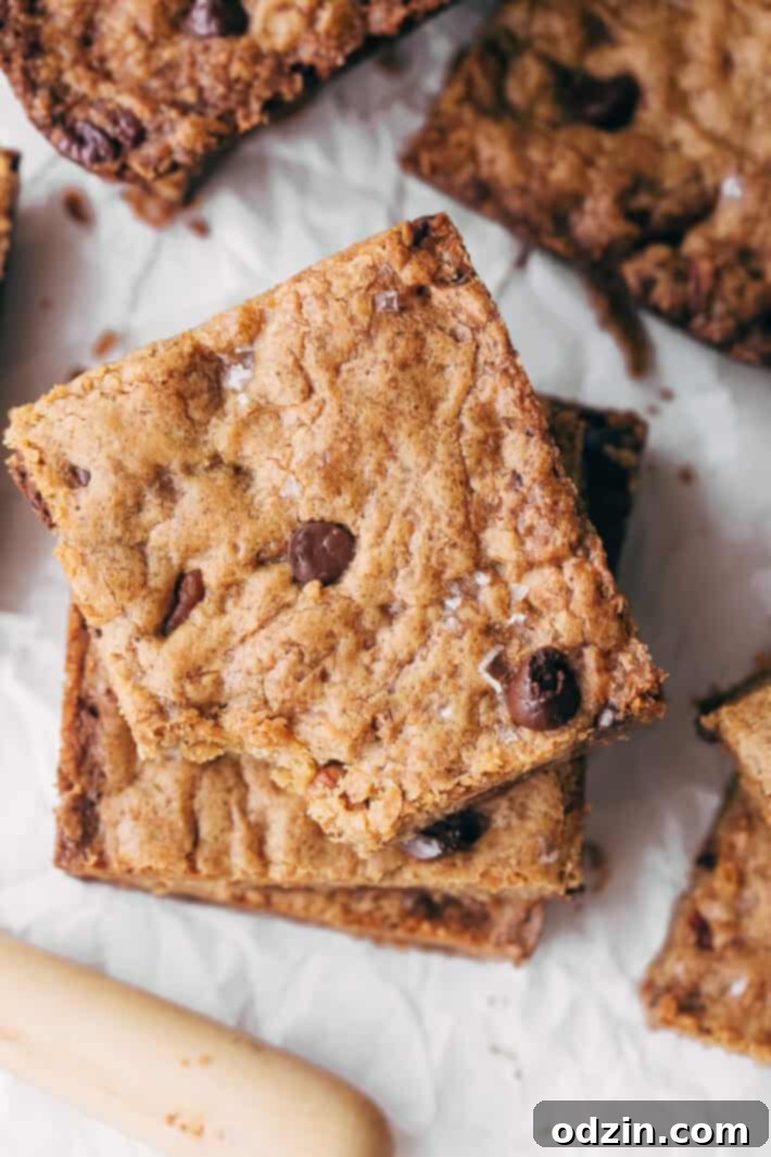 Brown Butter Pecan Chocolate Chip Blondies - butterscotch flavored base with tons of nutty pecans and creamy chocolate chips. These blondies are absolutely addicting! #blondies #chocolatechipblondies #brownbutterblondies #pecanblondies | Littlespicejar.com