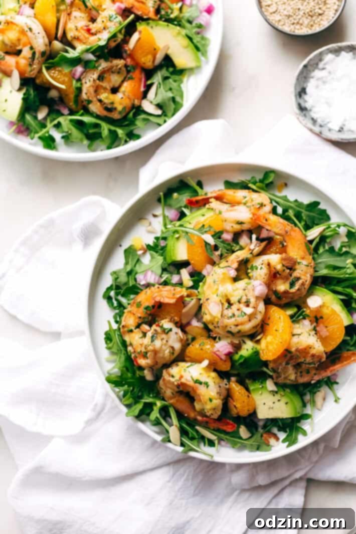 Avocado Shrimp Salad with Citrus Miso Dressing - learn how to make a quick and easy shrimp salad loaded with tons avocados, mandarin oranges, and sliced almonds! #shrimpsalad #salad #lowcarb #avocadoshrimpsalad | Littlespicejar.com