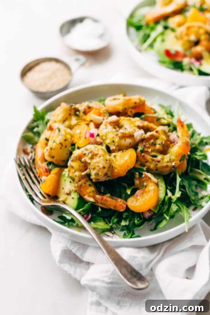 Avocado Shrimp Salad with Citrus Miso Dressing - learn how to make a quick and easy shrimp salad loaded with tons avocados, mandarin oranges, and sliced almonds! #shrimpsalad #salad #lowcarb #avocadoshrimpsalad | Littlespicejar.com