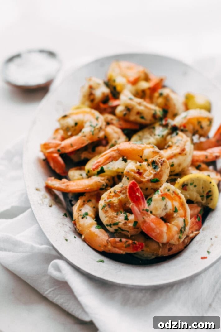 Avocado Shrimp Salad with Citrus Miso Dressing - learn how to make a quick and easy shrimp salad loaded with tons avocados, mandarin oranges, and sliced almonds! #shrimpsalad #salad #lowcarb #avocadoshrimpsalad | Littlespicejar.com