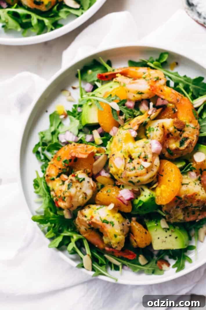 Avocado Shrimp Salad with Citrus Miso Dressing - learn how to make a quick and easy shrimp salad loaded with tons avocados, mandarin oranges, and sliced almonds! #shrimpsalad #salad #lowcarb #avocadoshrimpsalad | Littlespicejar.com