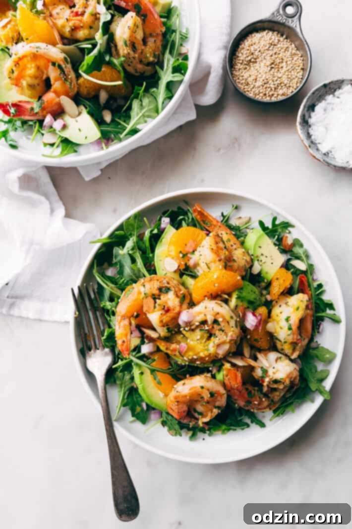 Avocado Shrimp Salad with Citrus Miso Dressing - learn how to make a quick and easy shrimp salad loaded with tons avocados, mandarin oranges, and sliced almonds! #shrimpsalad #salad #lowcarb #avocadoshrimpsalad | Littlespicejar.com