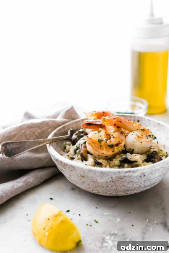 Mushroom Parmesan Shrimp Risotto - Learn how to make shrimp risotto at home with ease! Loaded with sautéed mushrooms, shrimp and tons of garlic! #shrimprisotto #mushroomrisotto #parmesanrisotto #homemaderisotto | Littlespicejar.com