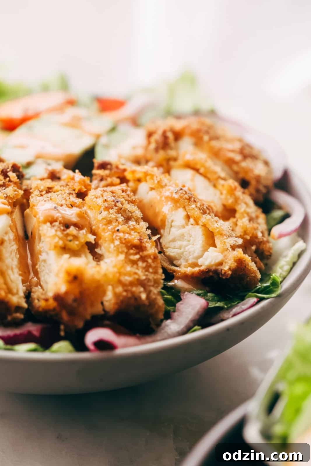 crispy chicken breasts sliced into strips