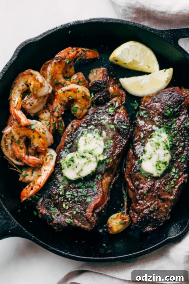 Garlic Butter Skillet Steak and Shrimp recipe card image.