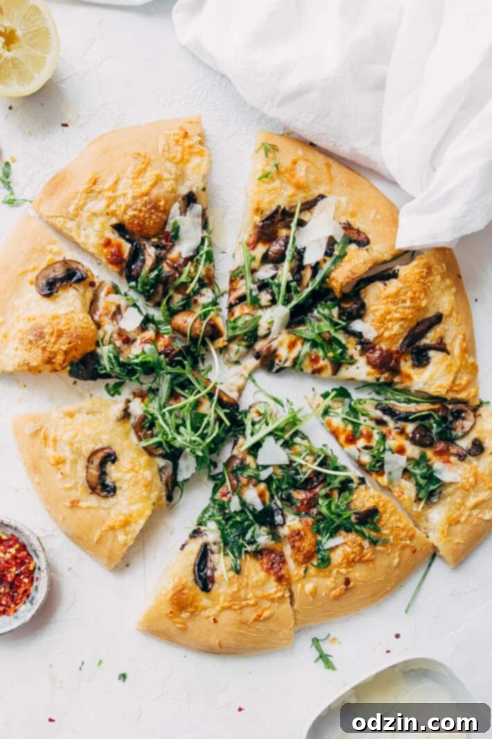 Delicious Homemade Truffled Mushroom Pizza with fresh ingredients, perfect for a gourmet meal at home. Learn how to make this easy recipe for a fancy pizza experience.