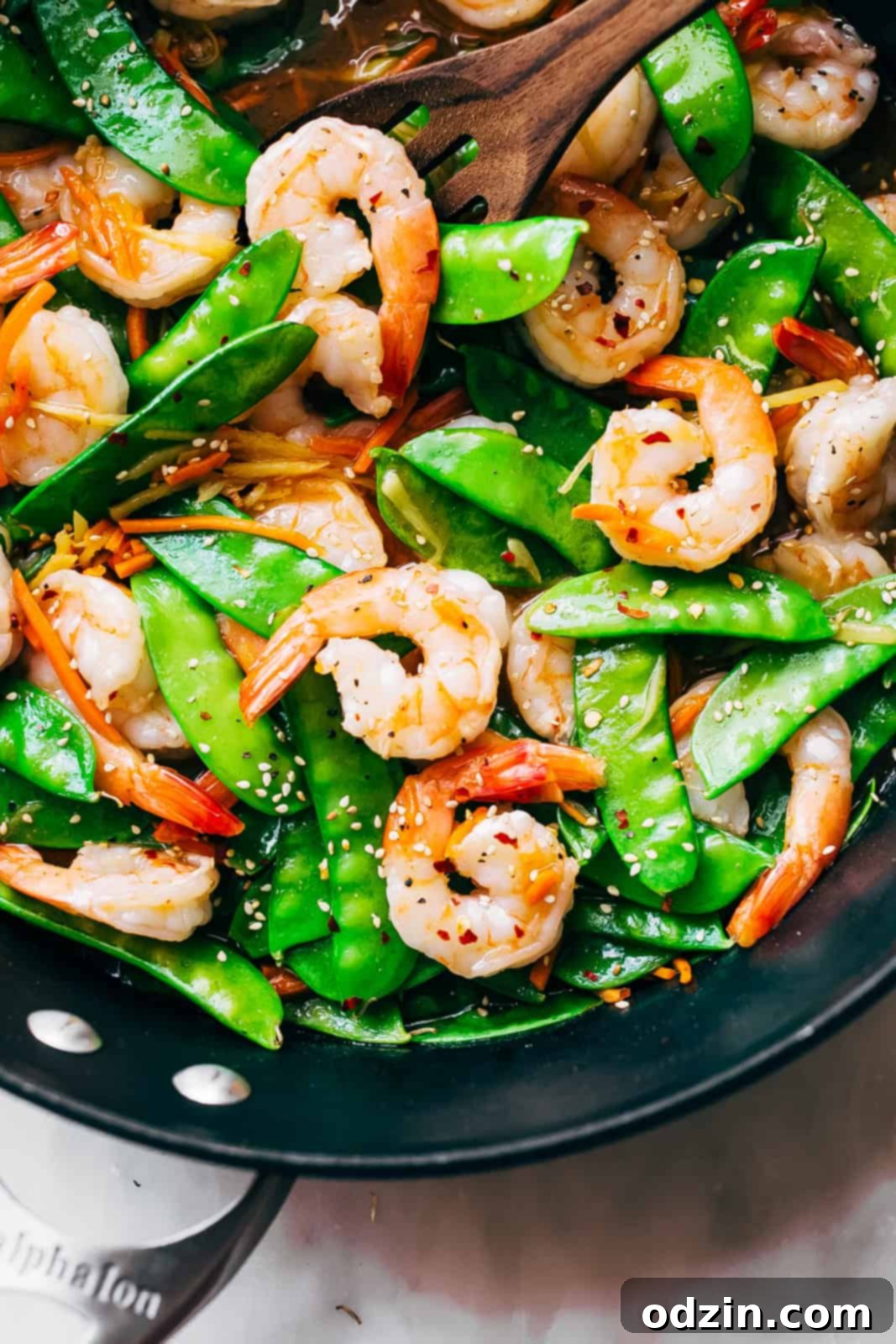 Speedy Ginger Shrimp and Snow Pea Stir Fry 3 close up of ginger shrimp stir fry showing perfectly cooked, curved shrimp and bright green snow peas
