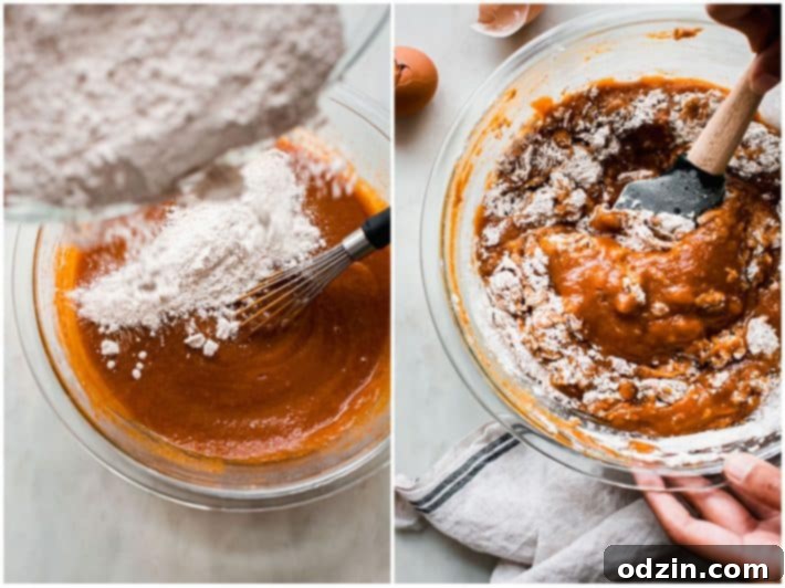 Chai-Spiced Pumpkin Cream Cheese Muffins 4 Step-by-step image showing the mixing process of pumpkin muffin batter in a bowl.
