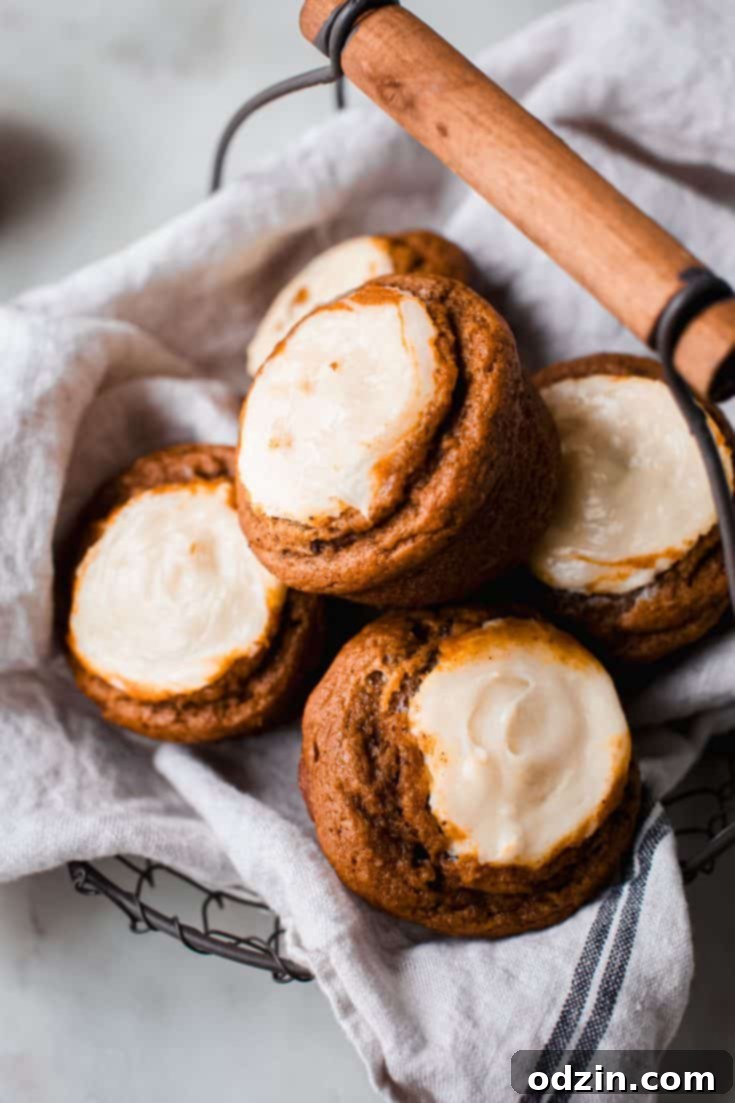 Chai Pumpkin Cheesecake Muffins with a prominent cheesecake swirl.