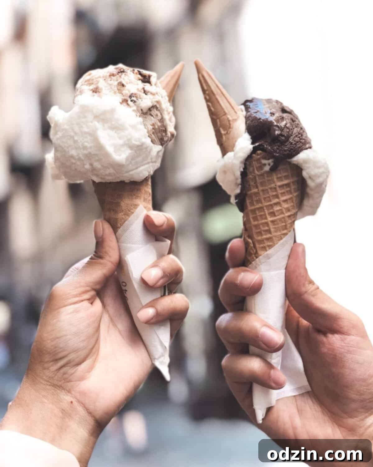The Best Recipes of 2018 A Year End Roundup 2 Two hands holding cones of vibrant gelato against a sunny sky, symbolizing joy and travel memories