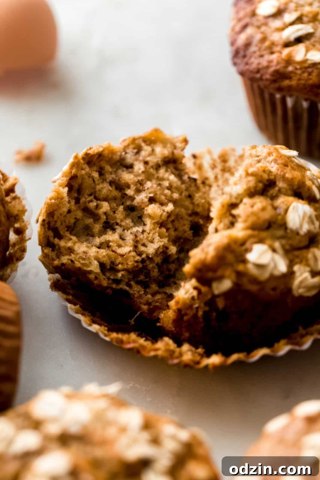 broken muffin showing inside texture of banana nut muffin