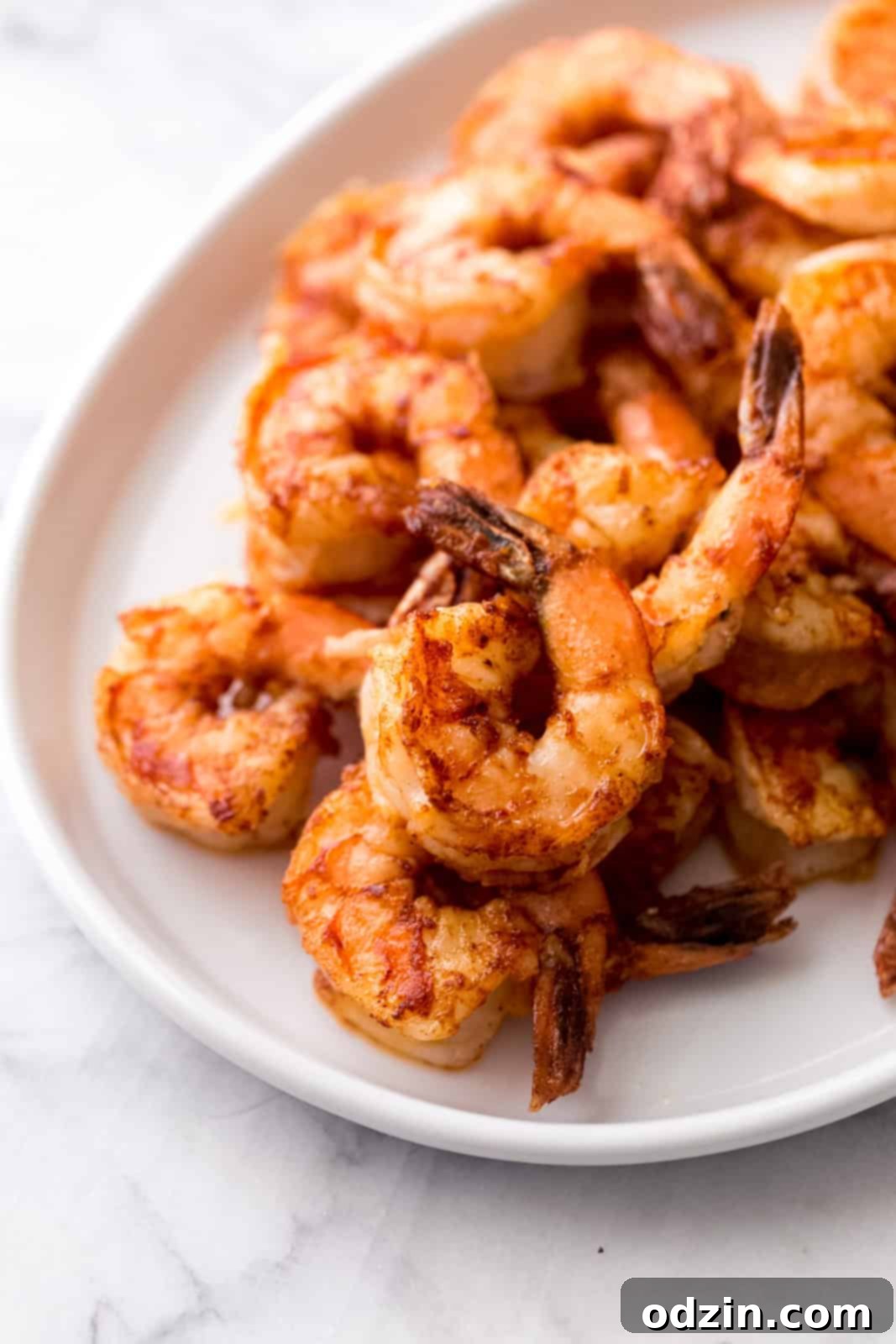 Plated Hawaiian shrimp scampi, showcasing the rich sauce and succulent shrimp, ready to be enjoyed