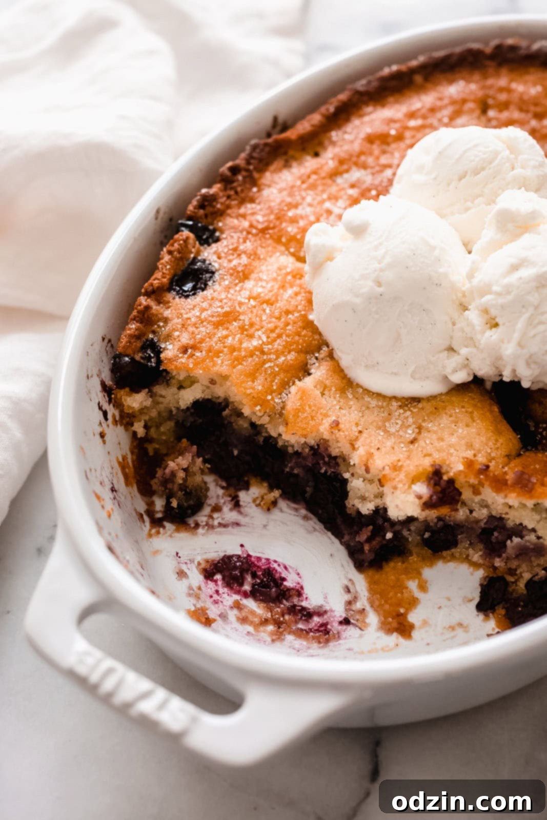 Effortless Texas Blueberry Cobbler 6 close up of staub dish showing cobbler texture