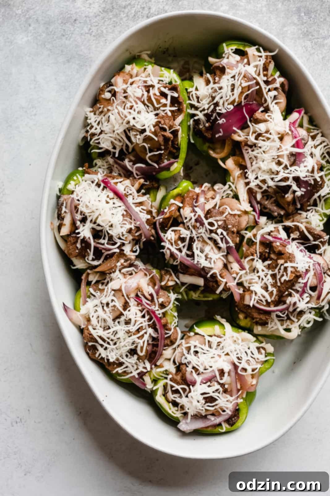 stuffed peppers topped with shredded cheese