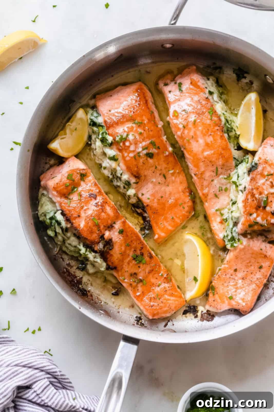 prepared seared salmon filets in stainless steel sauce pan
