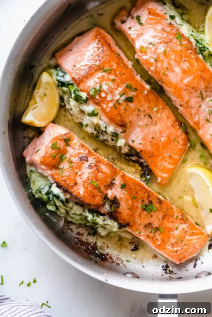 Creamy Spinach Artichoke Stuffed Salmon with Lemon Butter Sauce