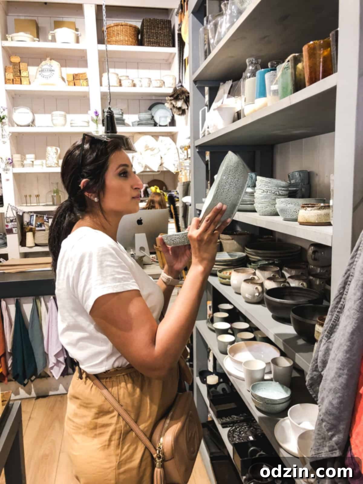 me purchasing dishes from a little home goods shop