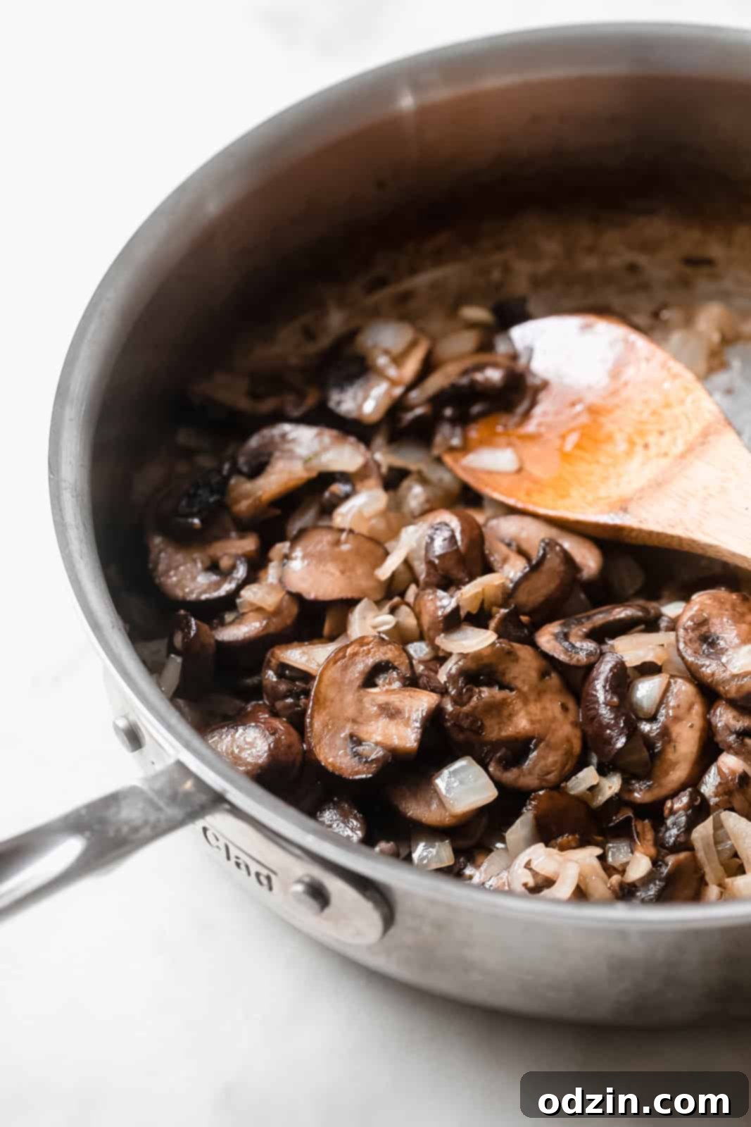 onions and mushrooms sautéed in skillet