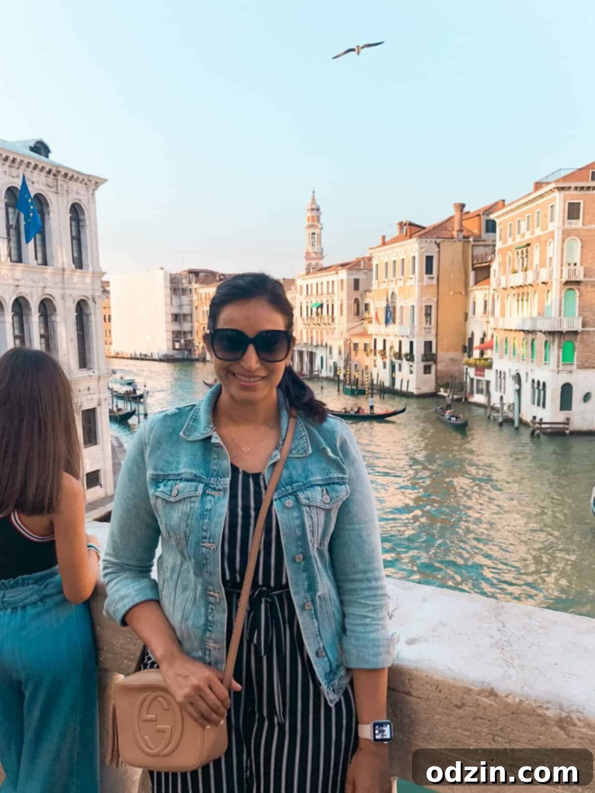 a picture of me with the canals and a gondola in the background