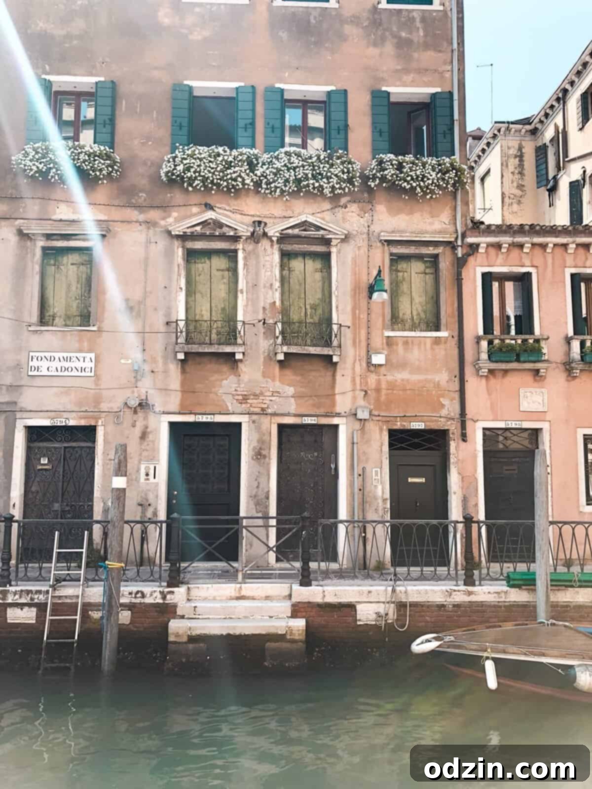 picture of flowers on balconies on the canals