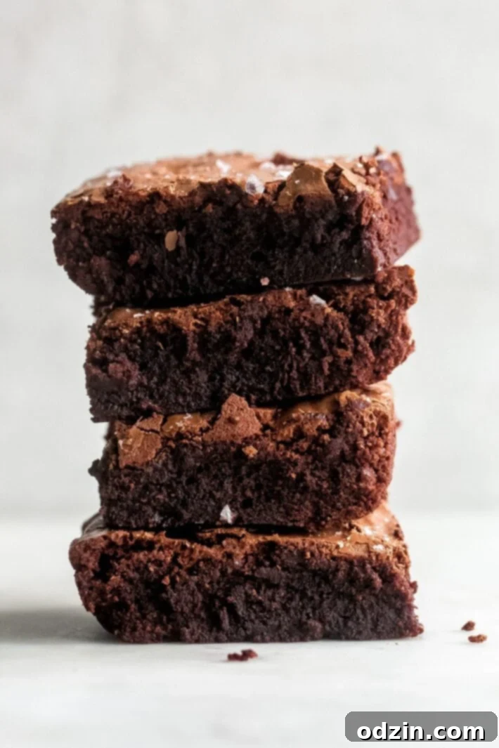 Decadent Pan-Banging Salted Fudge Brownies 2 stack of fudge brownies showcasing their rich, fudgy texture