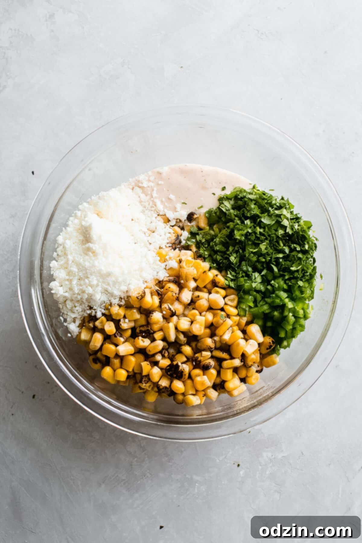 bowl with all the ingredients for Mexican corn dip