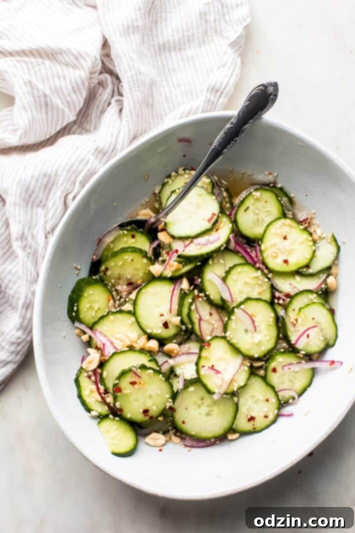 bowl with cucumber salad with red onions and sesame seeds