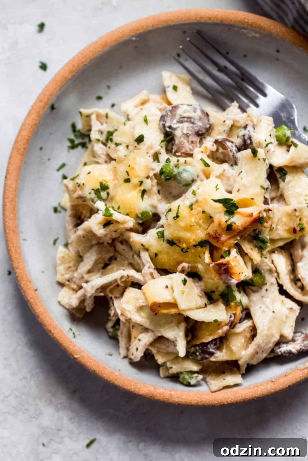 Cozy Leftover Turkey Pasta Bake Works With Chicken Too 8 plate with turkey pasta bake topped with fresh parsley