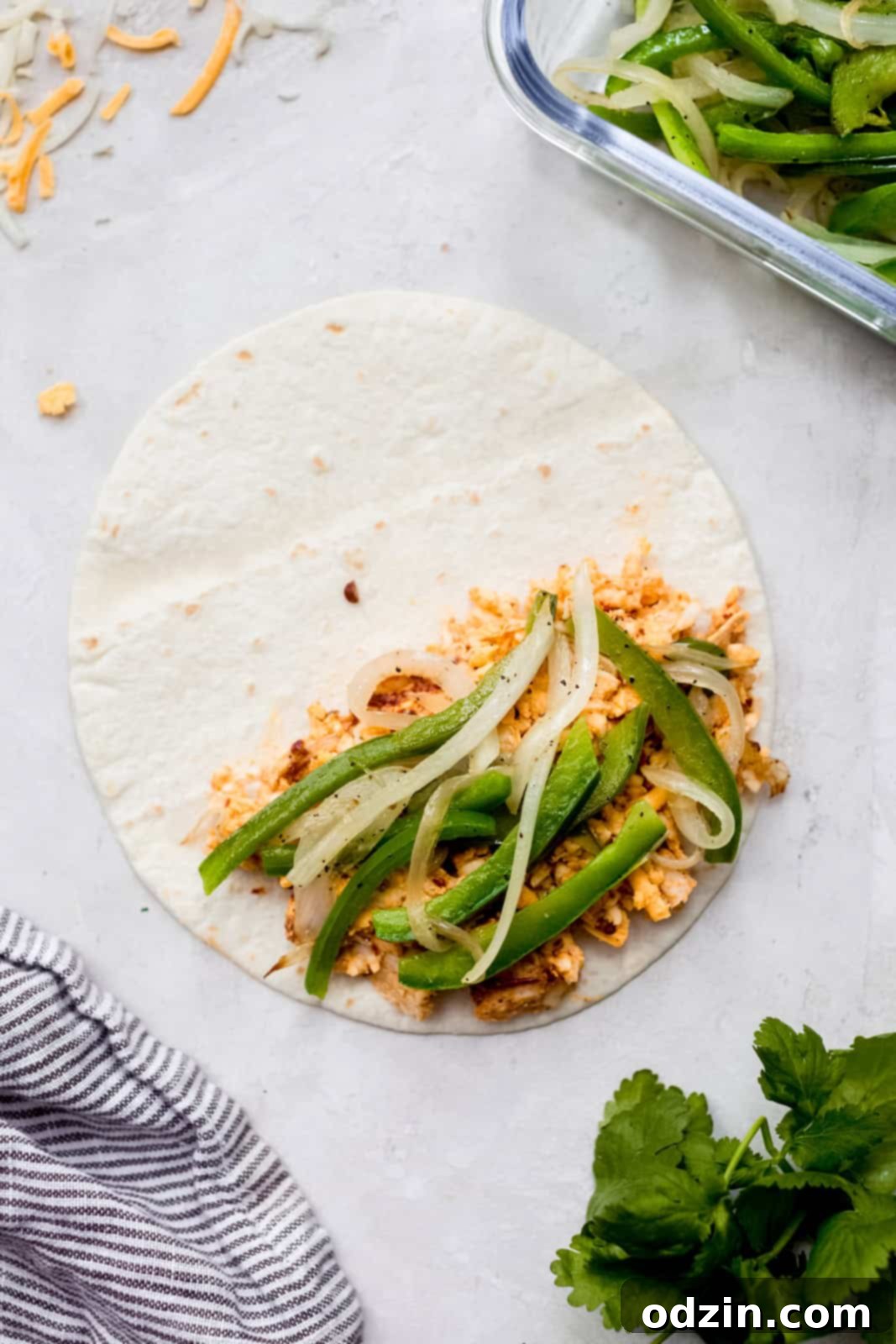 Oven-Crisped Chicken Quesadillas 6 chicken mixture and peppers and onions on one side of a tortilla