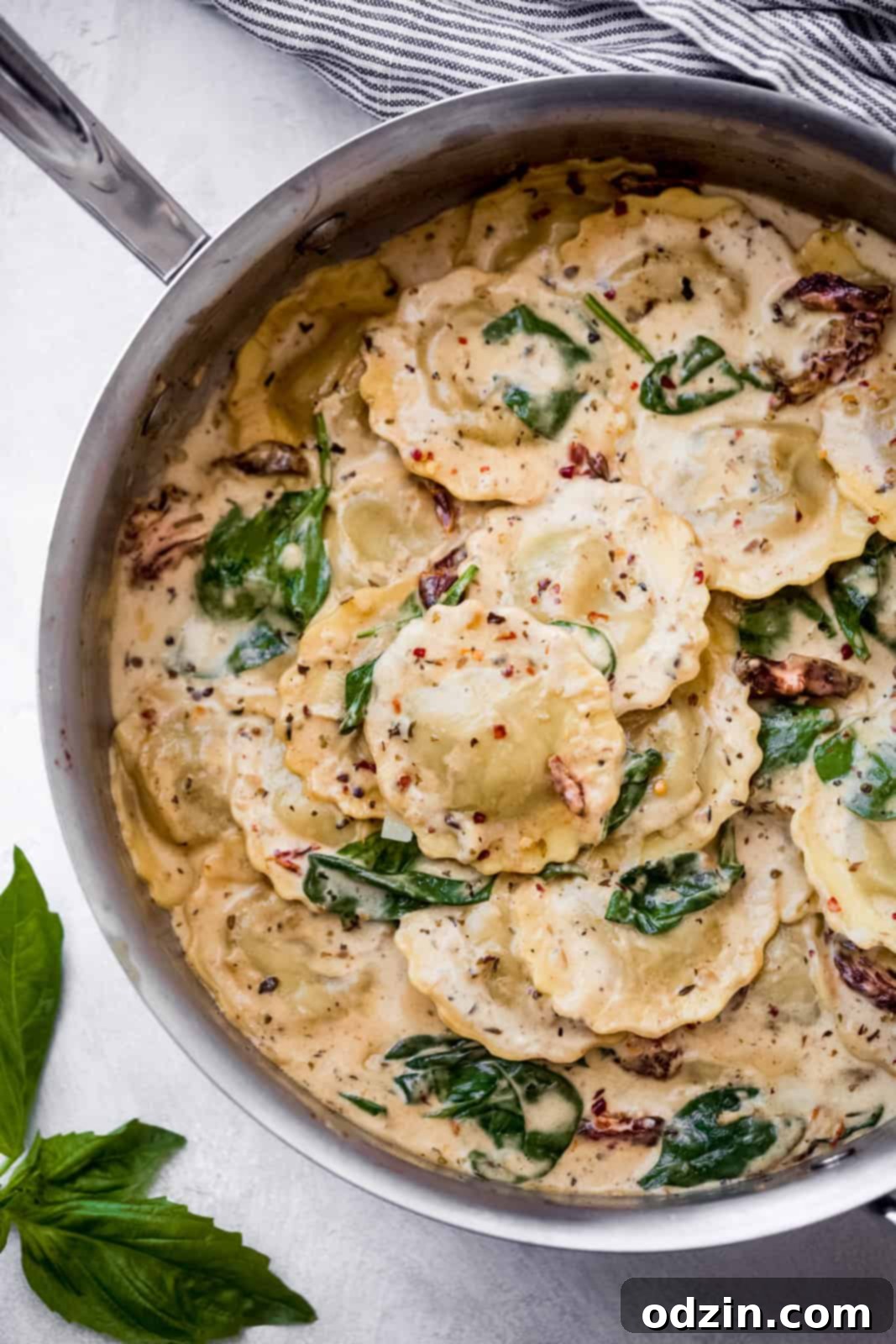 Creamy Tuscan Ravioli For An Unforgettable Date Night 4 tuscan ravioli in a skillet