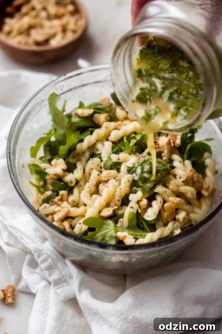 tossing pasta salad with lemon basil salad dressing tossing pasta salad with lemon basil salad dressing