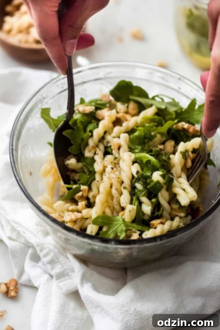 tossing pasta salad with lemon basil salad dressing tossing pasta salad with lemon basil salad dressing