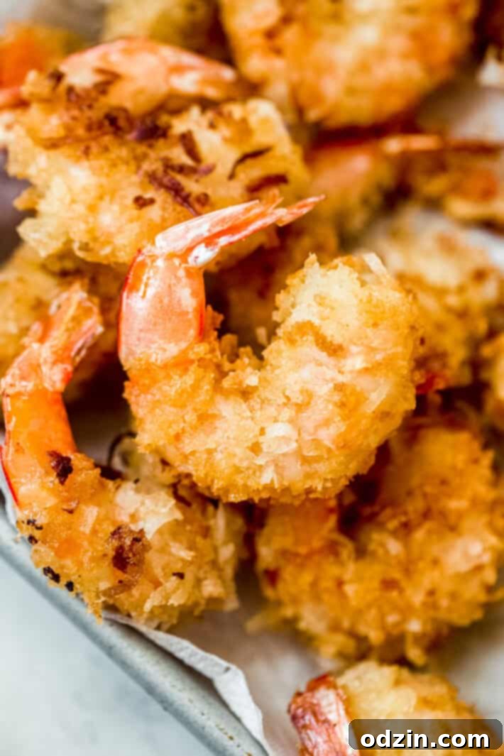 close up of golden brown crispy coconut shrimp