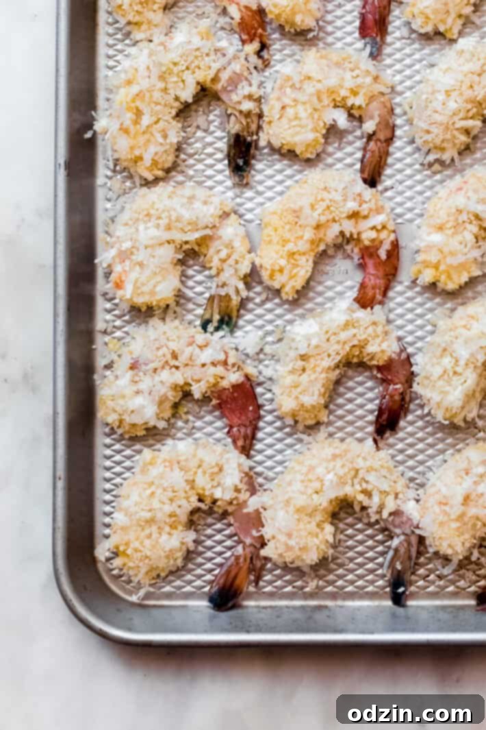 coconut shrimp on baking sheet