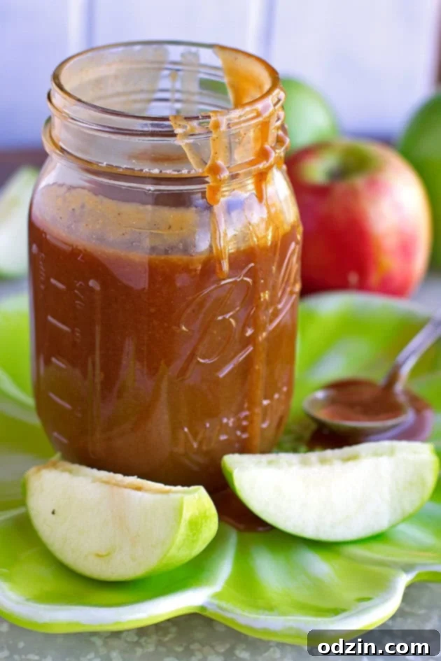 Apple Cider Caramel Sauce Close-up of golden Apple Cider Caramel Sauce in a jar, ready to be served.