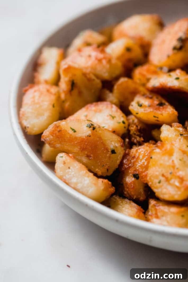 Crispy Garlic Oven Potatoes 8 close up or crispy roasted potato texture in bowl
