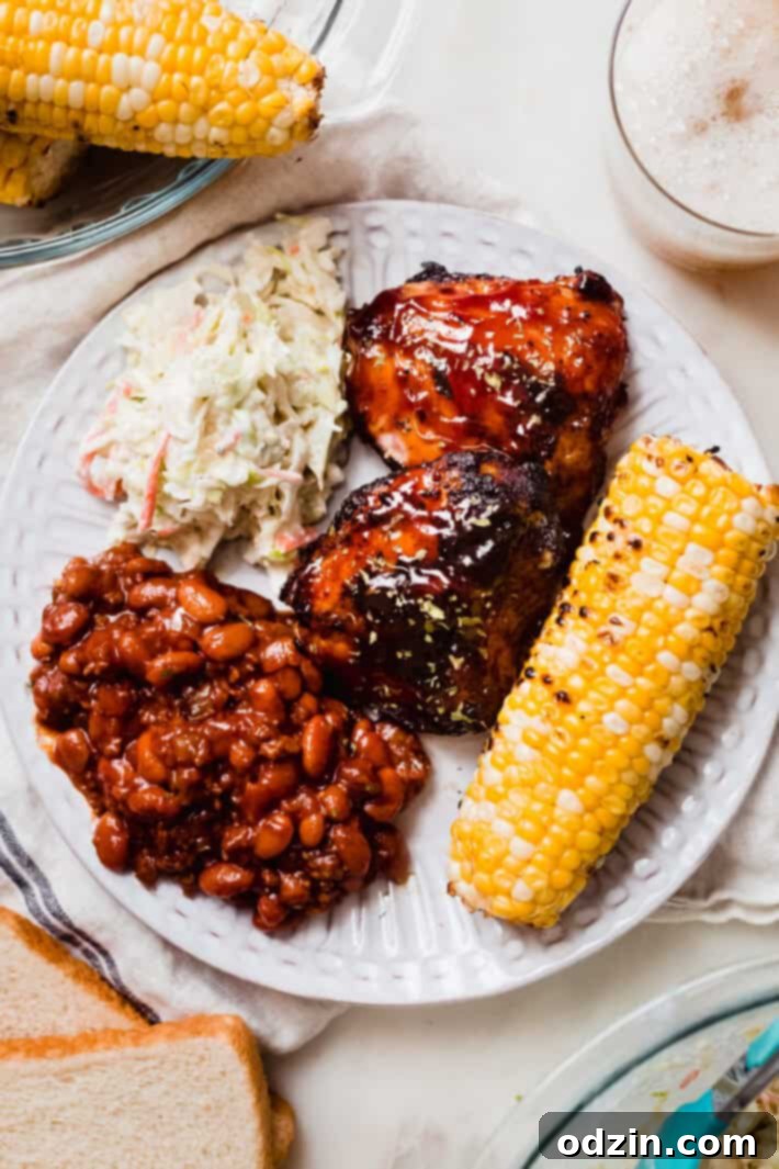 The Perfect Summer Coleslaw 7 plate with grilled corn, coleslaw, bbq chicken, and baked beans