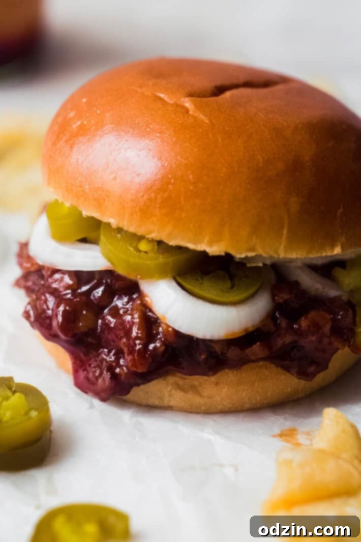 chopped brisket meat with onions and pickled jalapeños on brioche buns