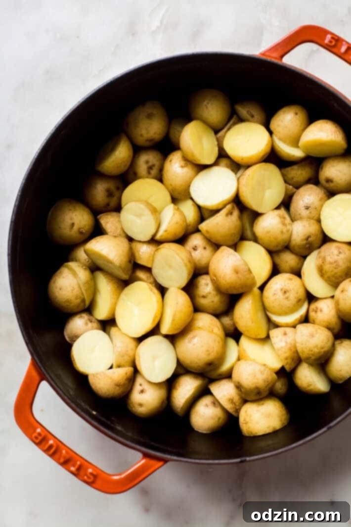 boiled and drained Yukon Gold potatoes in cast iron pot