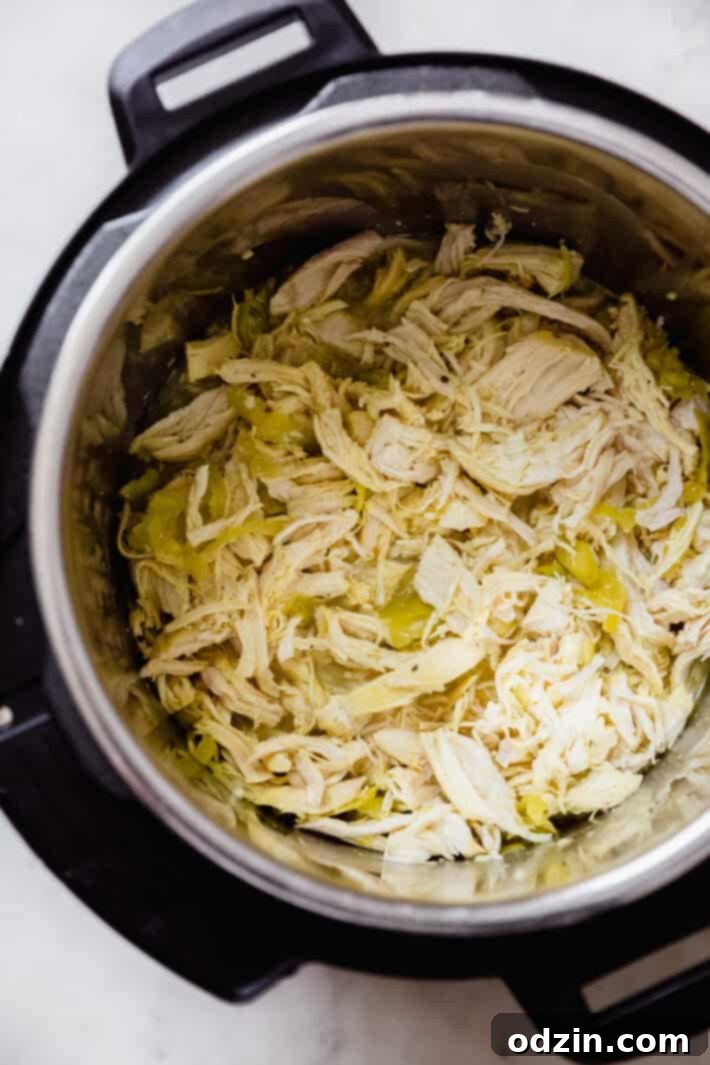 Zesty 5-Ingredient Pepperoncini Chicken 2 Shredded pepperoncini chicken ready to be served from an Instant Pot