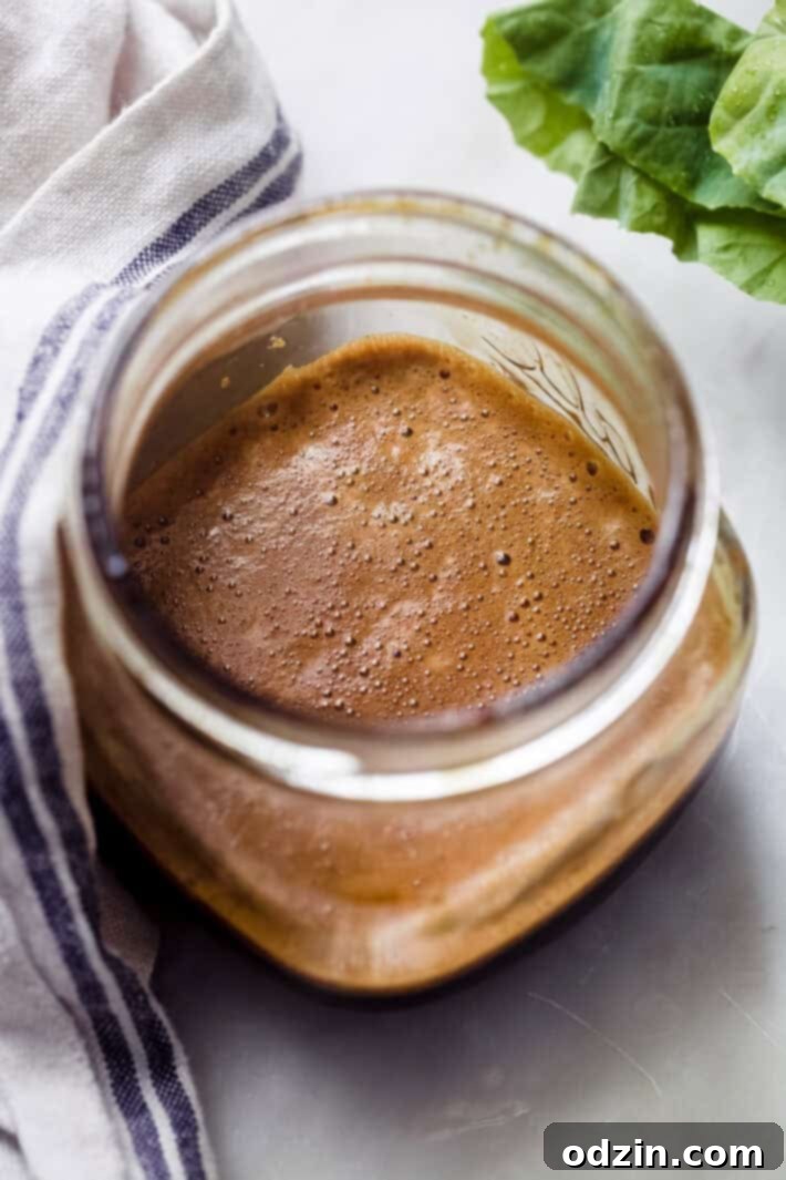 Prepared sauce for Pad See Ew neatly mixed in a mason jar, ready to be added to the stir-fry.