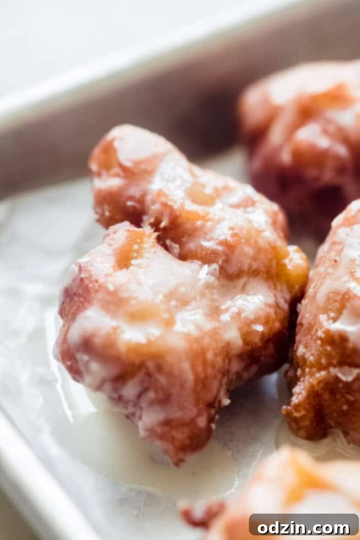 Effortless Maple Honeycrisp Apple Fritters 6 close up shot of fritter with sparkling sugar