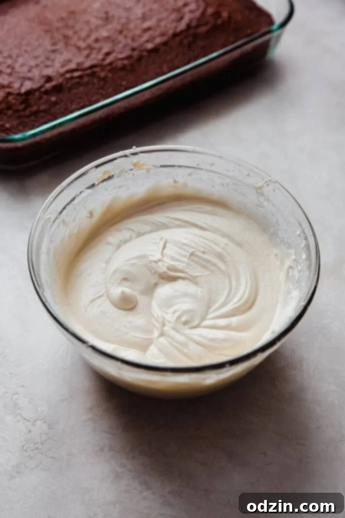 Simply Perfect Moist Spice Cake with Cream Cheese Frosting 5 Freshly baked spice cake cooling on a wire rack