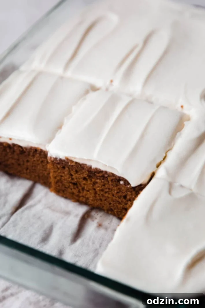 Simply Perfect Moist Spice Cake with Cream Cheese Frosting 7 Overhead view of a beautiful spice cake with frosting and pecans