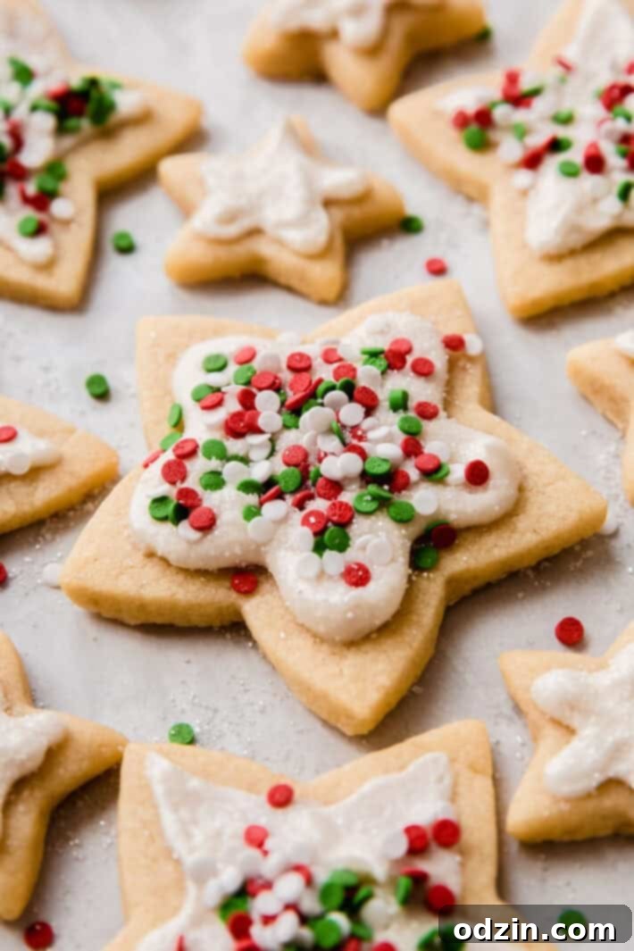 The Ultimate Cut-Out Sugar Cookies: 5 Tips for Baking Perfection 3 sugar cookies with frosting and Christmas sprinkles